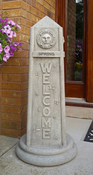 Four-Sided Welcome Obelisk Spring Flowers Sun Depiction Sculpture
